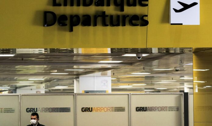 01_trabalhador_mascara_protetora_aeroporto_internacional_de_guarulhos_coronavirus_covid-19_guarulhosreuters_12042000150