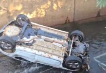Carro capota na Av. Ernesto Geisel e vai parar dentro do córrego Segredo