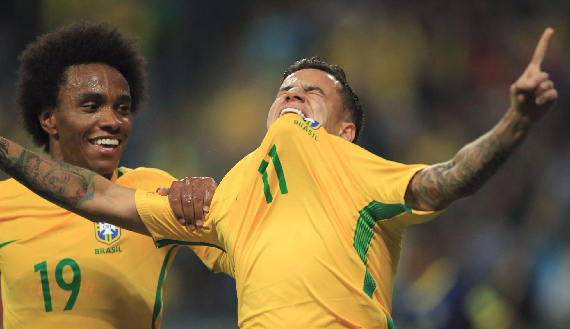 Philippe Coutinho comemora o segundo gol do Brasil. ITAMAR AGUIAR - AFP