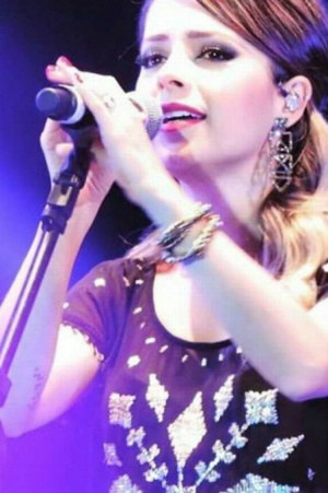 Sandy tatua o nome do filho em braile no braço direito