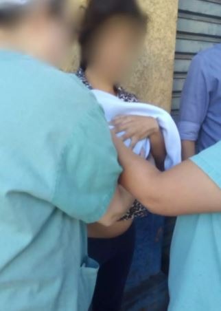 Casal é preso tentando fugir de hospital com filha. Larissa Tarifa/Reprodução