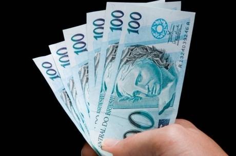Rendimento extra deve injetar R$ 200 bi na economia
Getty Images
